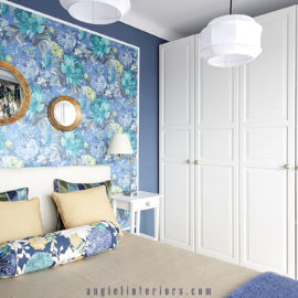Ikea closet and bed. Richloom St.Moritz floral fabric and A Shade Wilder Dianthus wallpaper in blue and white bedroom with gold accents