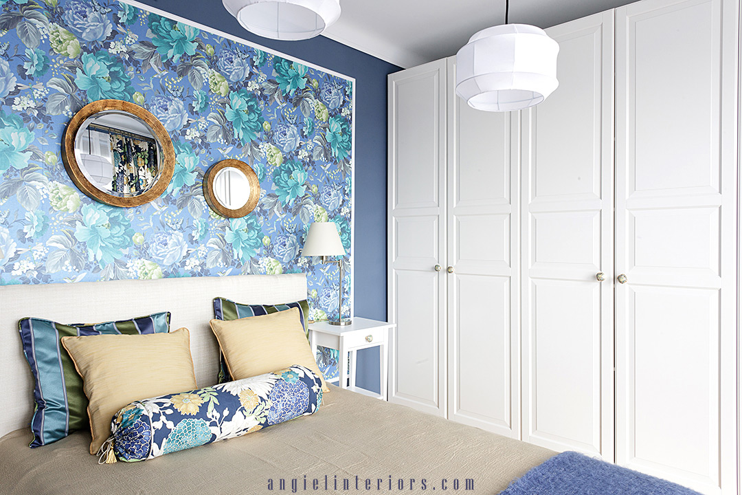 Ikea closet and bed. Richloom St.Moritz floral fabric and A Shade Wilder Dianthus wallpaper in blue and white bedroom with gold accents