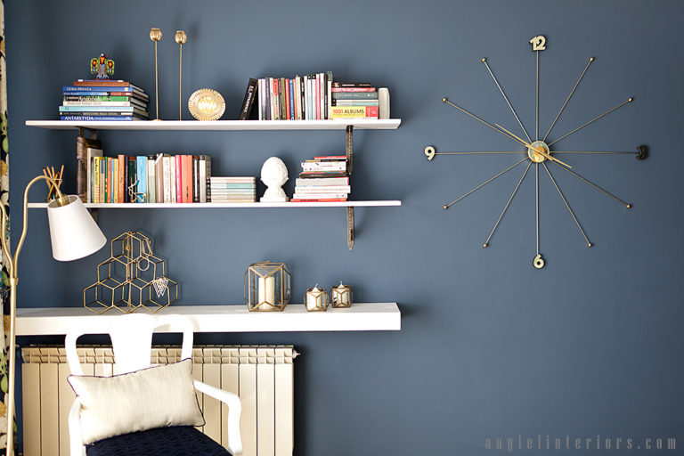 Kare Design Umbrella clock on navy walls with white shelves and gold accents