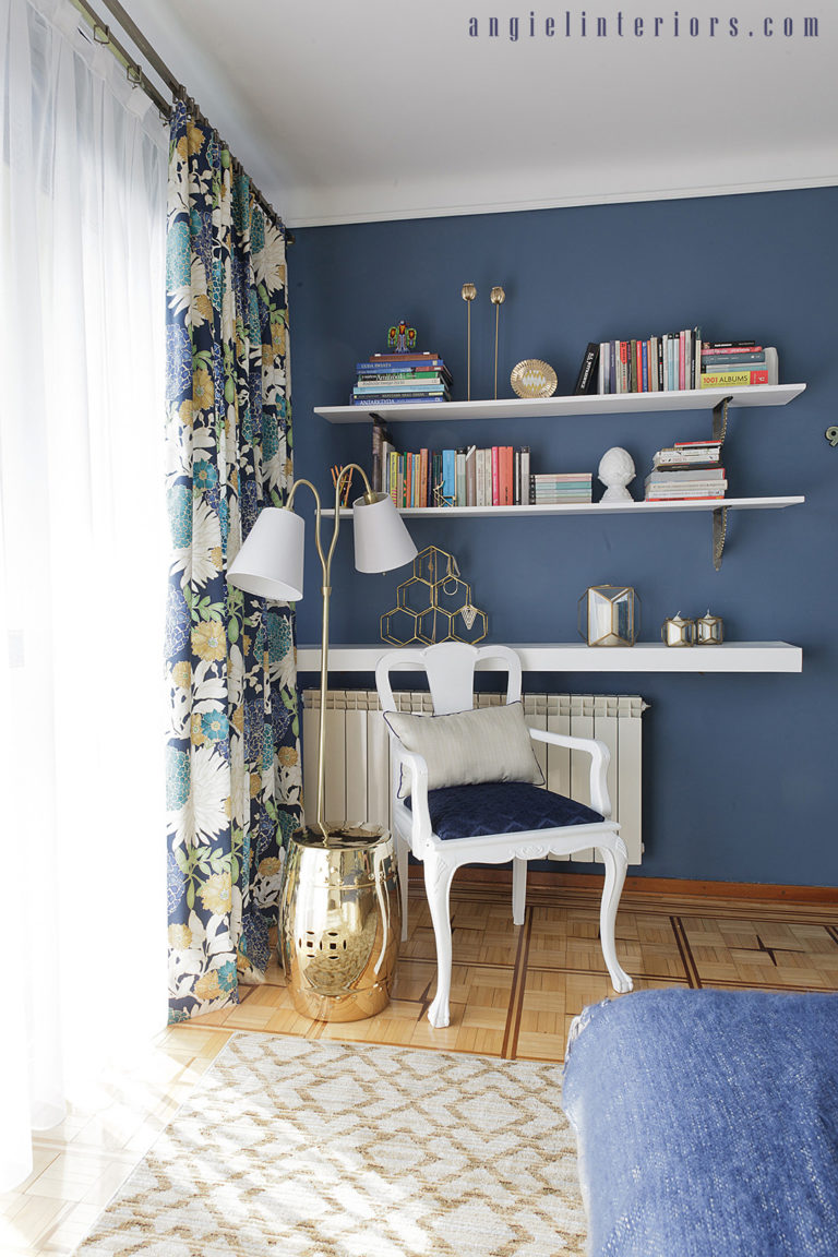 Navy walls and Richloom St.Moritz floral fabric in blue and white bedroom with gold accents