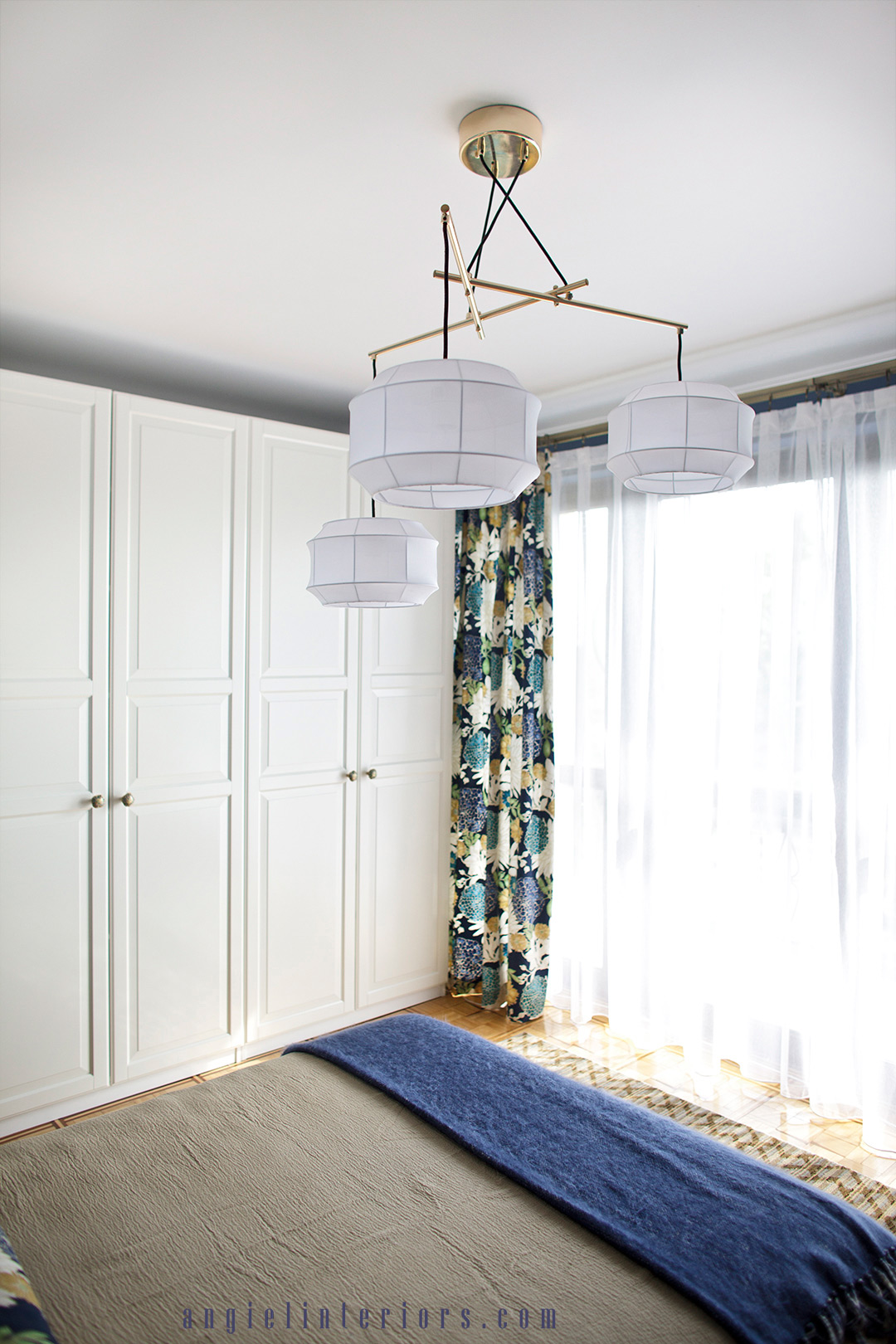 Ikea closet and Richloom St.Moritz floral fabric in blue and white bedroom with gold accents