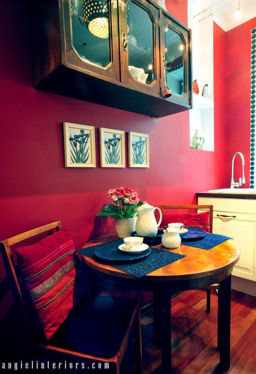 Red walls and white cabinets in kitchen