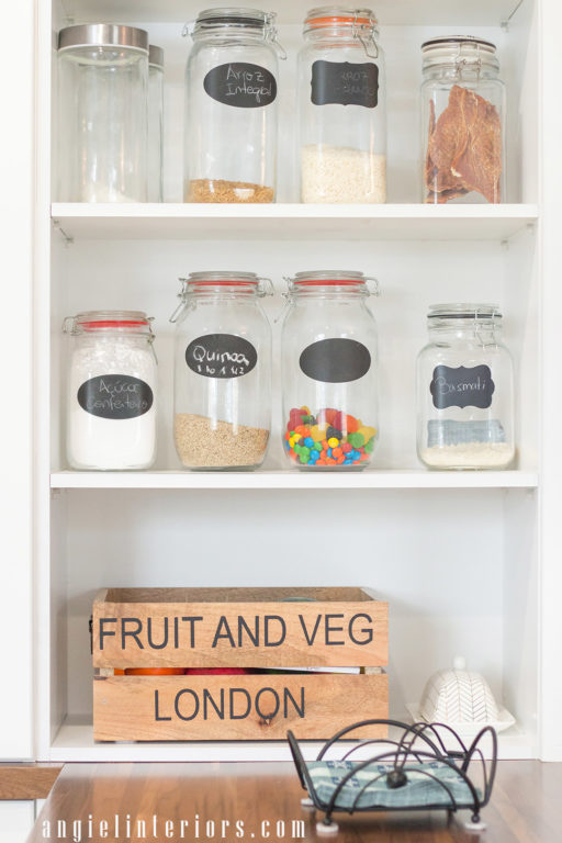 Open shelves over kitchen peninsula with butcher's block counter