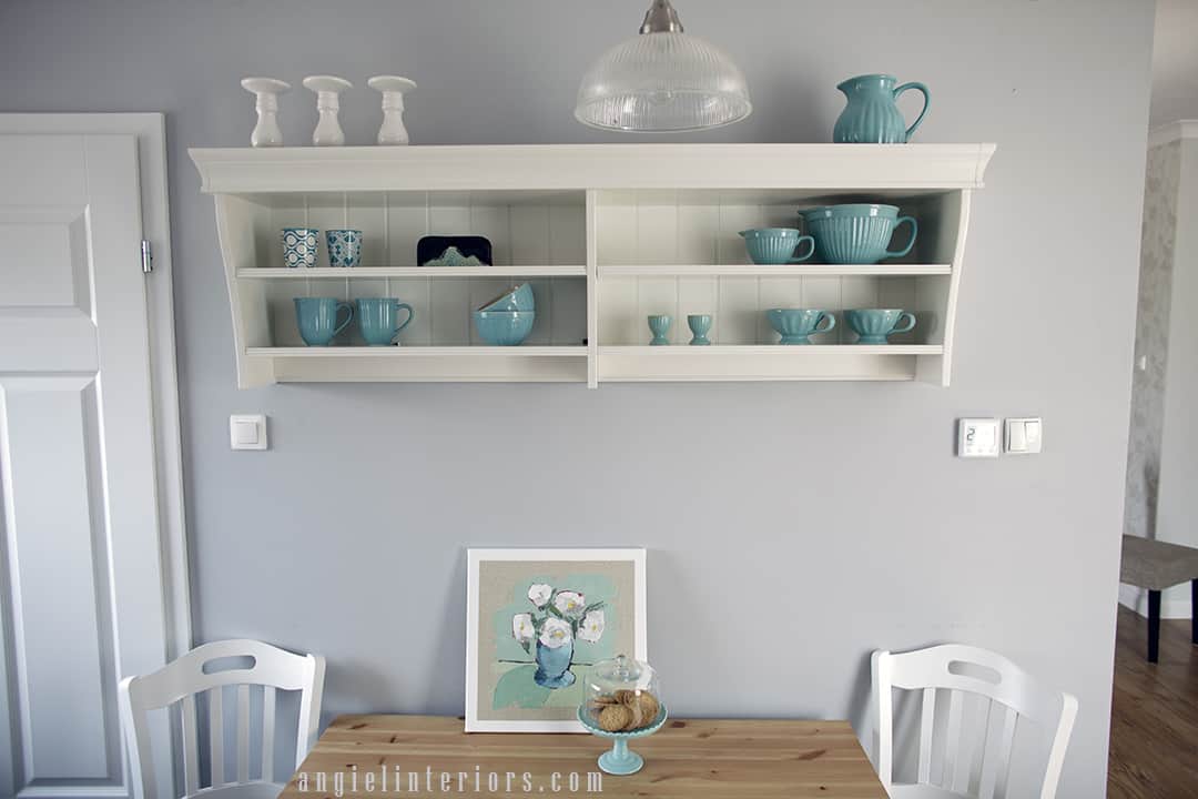 ikea liatorp shelf in the kitchen with turquoise accessories