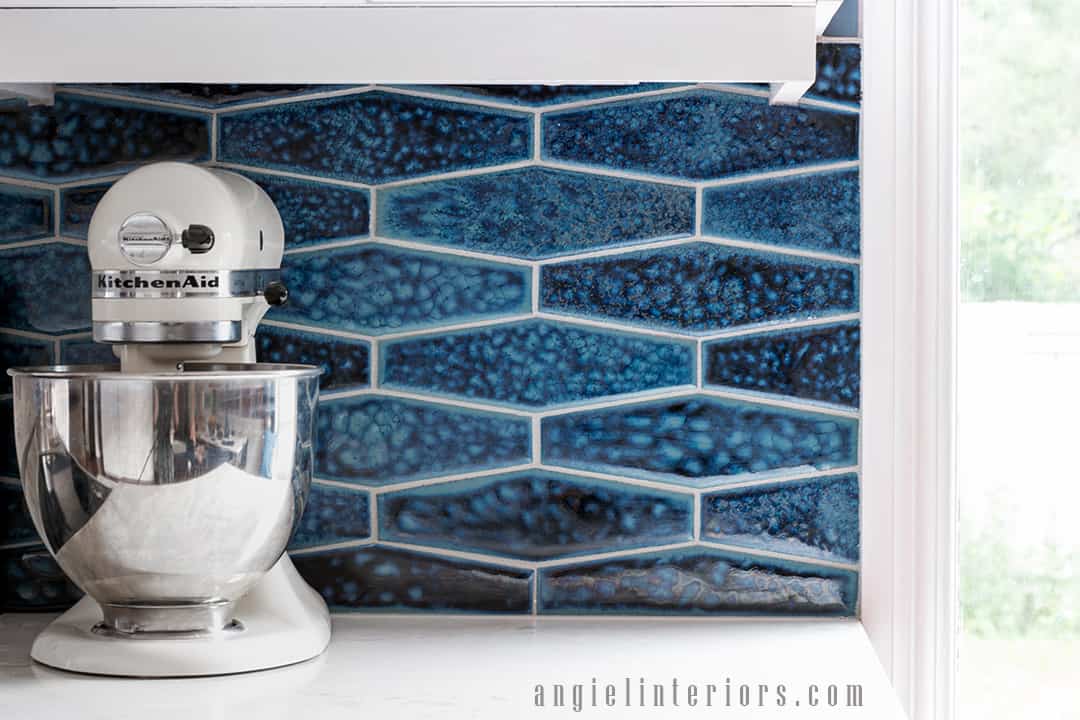 Custom handmade ceramic tiles in navy blue backsplash and Kitchen Aid stand mixer