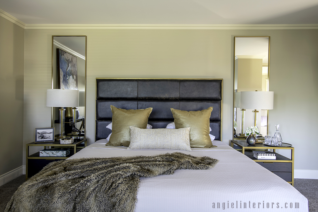 brass and leather headboard with gold mirrors, lamps, nightstand