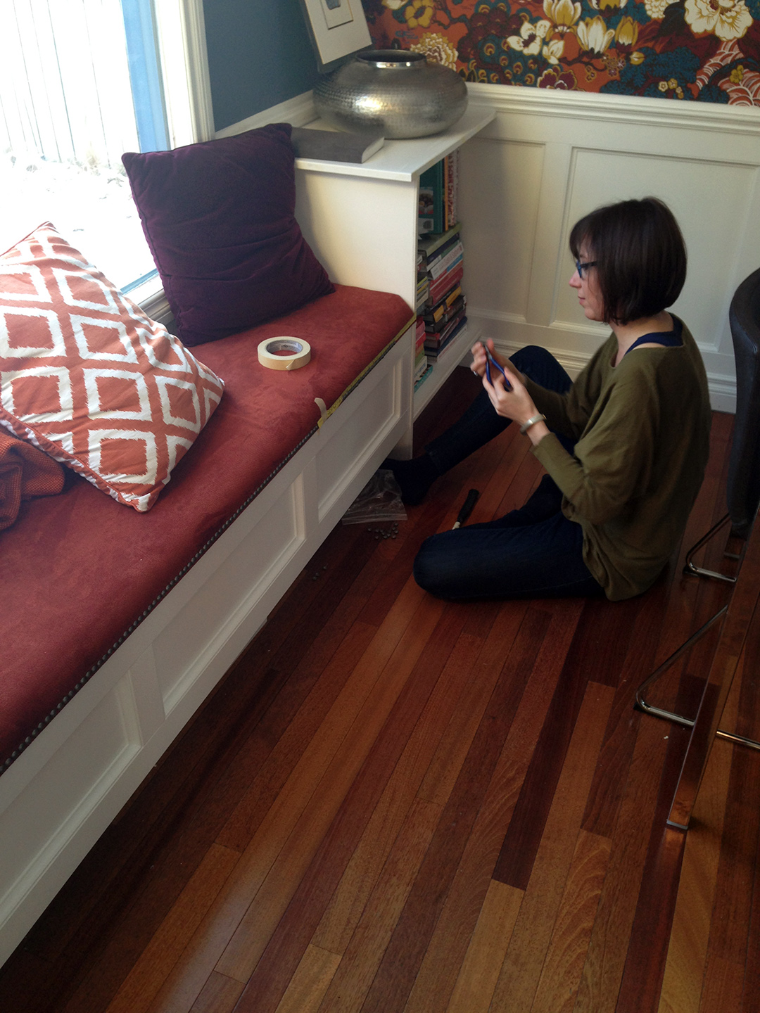 Custom window bench with upholstered top with decorative nails