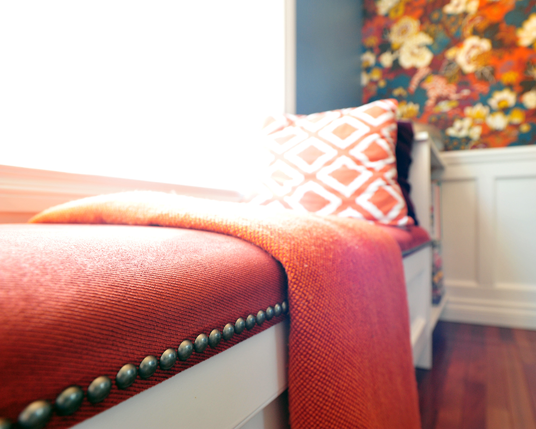 Upholstered window bench with soft round edge w finished with decorative nails